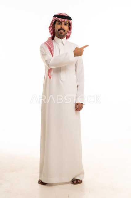 Saudi Man in Traditional Thobe Pointing Side