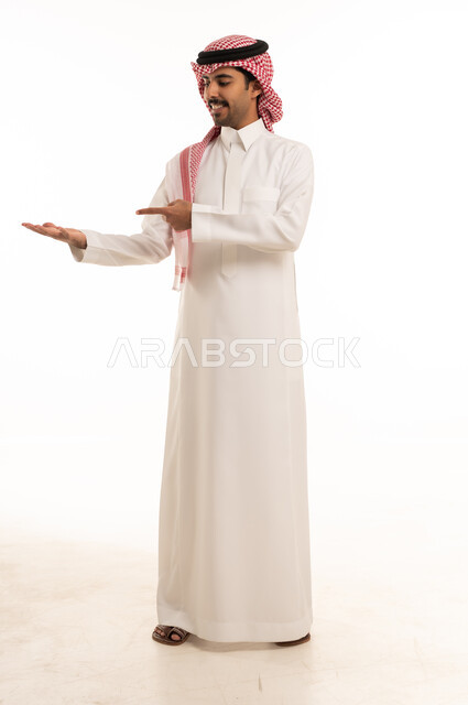 Saudi Man Pointing to Open Hand on White Background