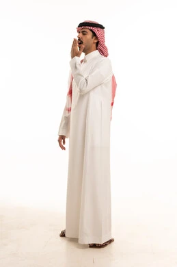 Tired Saudi Man Yawning in Traditional White Thobe