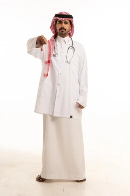 Saudi Doctor Giving Thumbs Down on White Background
