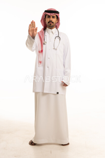 Saudi Male Doctor Making Stop Gesture in Studio