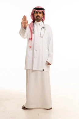 Saudi Male Doctor Making Stop Gesture in Studio