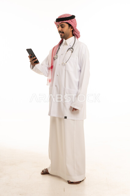 Saudi Male Doctor Using Smartphone in Studio