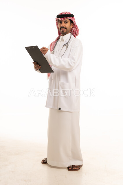 Saudi Male Physician Holding Clipboard in Medical Uniform