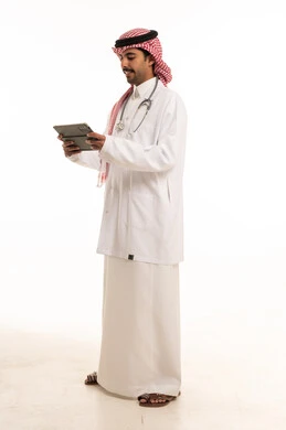 Saudi Male Doctor Using Digital Tablet on White Background
