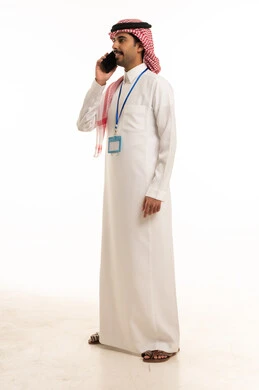 Saudi Man Talking on Smartphone in Traditional Thobe