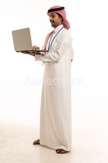 Saudi Businessman Using Laptop on White Background