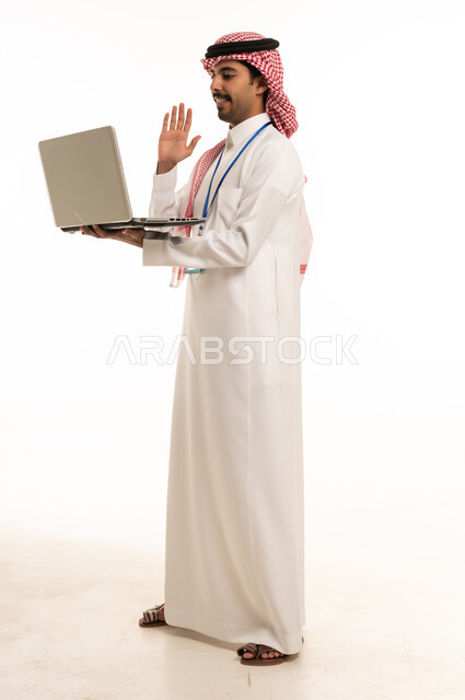 Saudi Man Using Laptop for Video Call on White Background