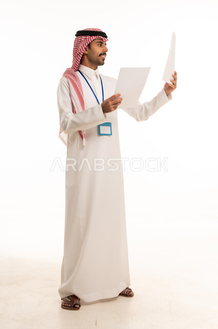 Saudi Man Holding Business Documents on White Background