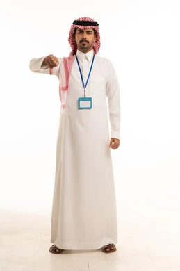 Saudi Man in Thobe Making Thumbs Down Gesture