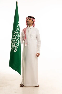 Saudi Man Holding National Flag on White Background