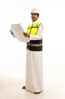 Saudi Engineer Holding Blueprints in Safety Gear