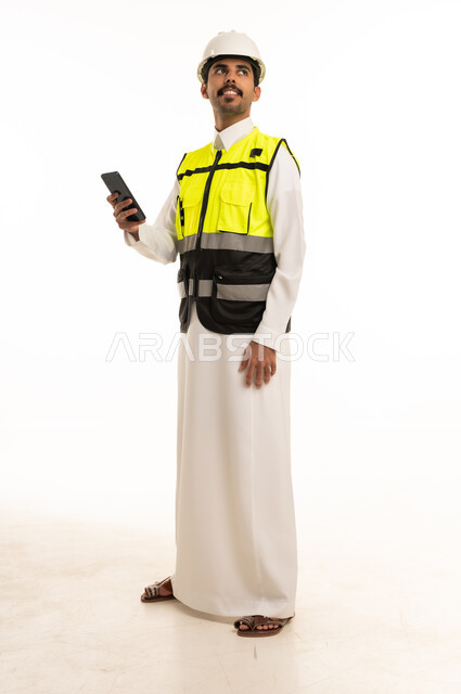 Saudi Engineer in Safety Vest Holding Smartphone