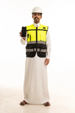Saudi Engineer in Safety Gear Holding Smartphone