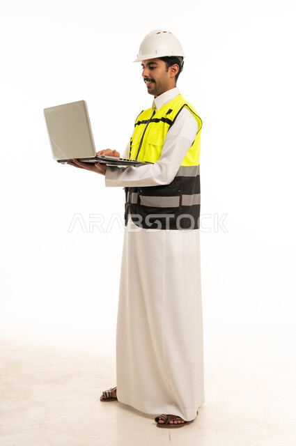 Saudi Engineer with Laptop and Safety Gear