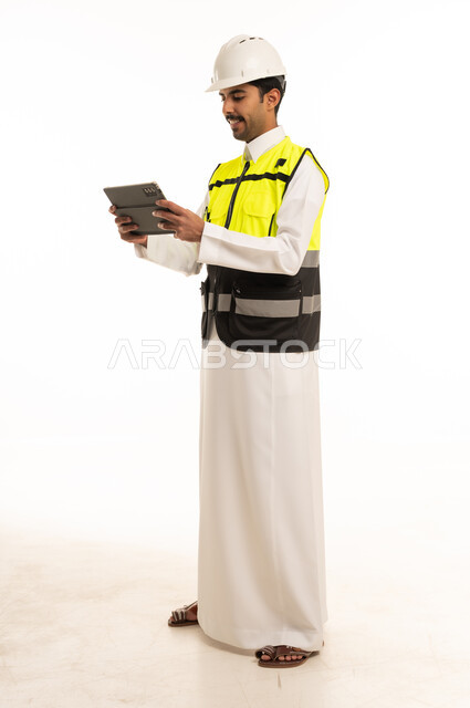 Saudi Engineer in Safety Vest Using Tablet on White