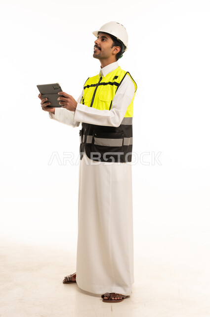 Saudi Engineer in Safety Gear with Digital Tablet