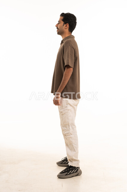 Saudi Man Standing in Profile Studio White Background