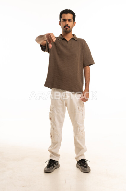 Saudi Man Giving Thumbs Down on White Background