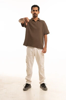 Saudi Man Giving Thumbs Down on White Background