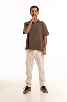 Saudi Man Making Silence Gesture on White Background