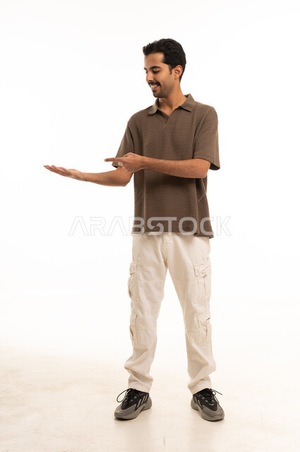 Saudi Man Pointing to Open Palm on White Background