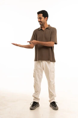 Saudi Man Pointing to Open Palm on White Background