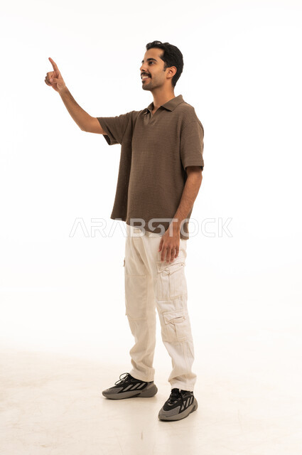 Saudi Man Pointing at Virtual Interface on White Background