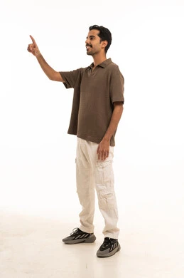 Saudi Man Pointing at Virtual Interface on White Background