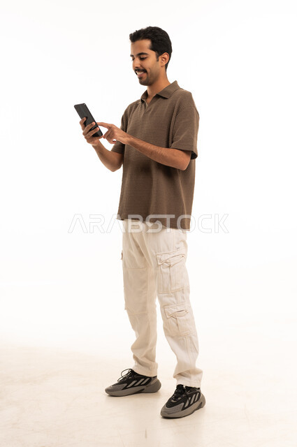 Saudi Man Using Smartphone on White Background