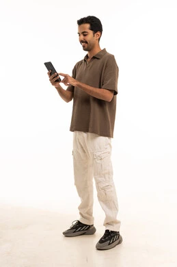 Saudi Man Using Smartphone on White Background