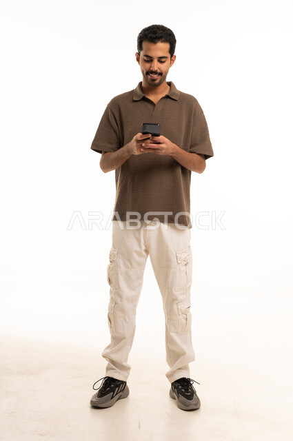 Saudi Man Using Smartphone on White Background