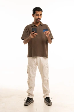 Saudi Man with Smartphone and Credit Card Studio Shot