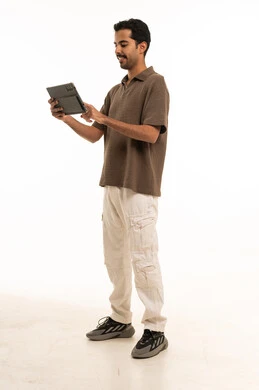 Saudi Man Using Digital Tablet on White Background