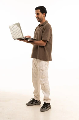Saudi Man Standing with Laptop on White Background