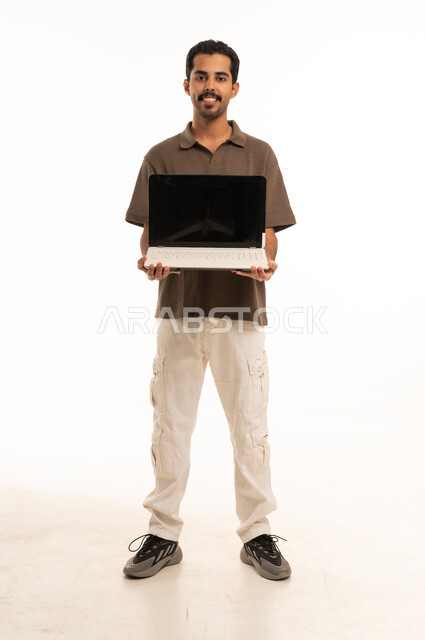 Saudi Man Holding Blank Laptop Screen Studio Shot