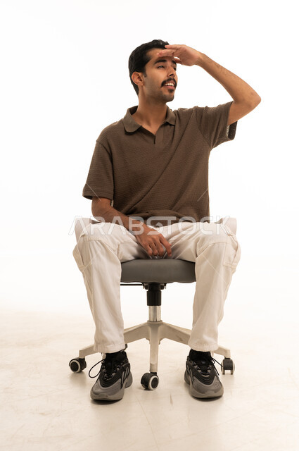 Saudi Man on Office Chair Looking into Distance