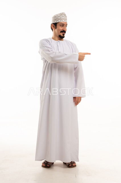 Omani Man in Traditional Dress Pointing on White
