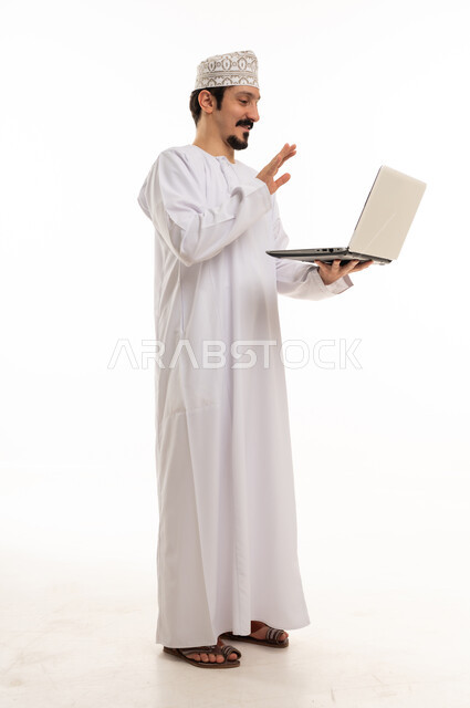 Omani Man with Laptop Waving on White Background