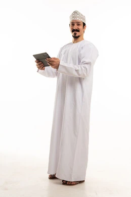 Omani Man in Traditional Dress Holding Digital Tablet