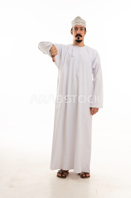 Omani Man Giving Thumbs Down Gesture on White Background