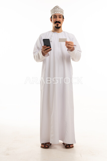 Omani Man with Smartphone and Card on White Background