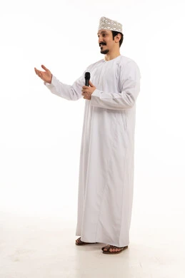 Omani Man Speaking into Microphone in Studio