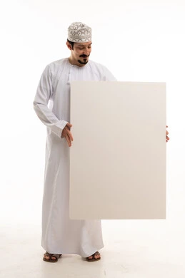 Omani Man in Traditional Dress Holding Blank White Board