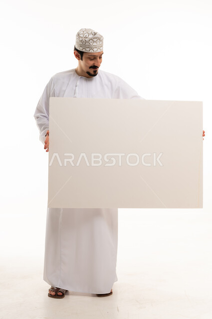 Omani Man Holding Blank White Board Studio Shot