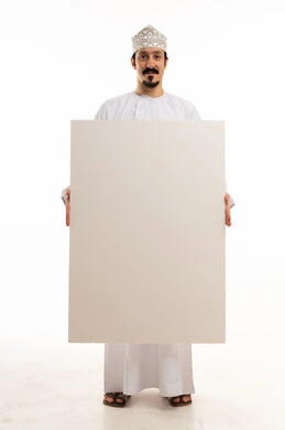 Omani Man in Traditional Dress Holding Blank Board