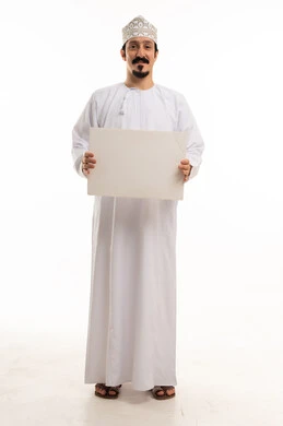 Omani Man in Traditional Dress Holding Blank Sign