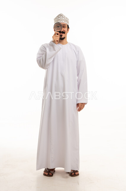 Omani Man with Magnifying Glass on White Background