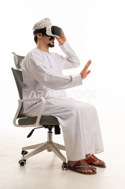 Omani Man Using VR Headset in Office Chair