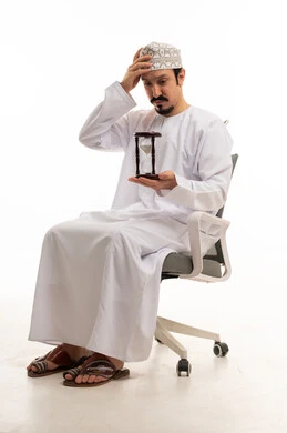 Omani Man with Hourglass and Office Chair on White Background